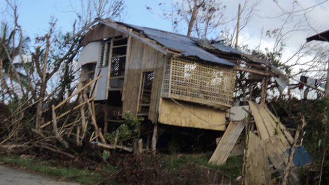 DESTRUCTION IN CAPIZ. A damaged home barely stands amid barren trees in Capiz. Photo by Gerdee Mae Pedregosa of Typhoon Yolanda Story Hub Visayas