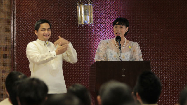 YOUTH'S MESSAGE. Carla Cucueco of Tulong sa Kapwa Kapatid delivers the finalists' response to the program as fellow finalist John Maunes interprets the speech in sign language.