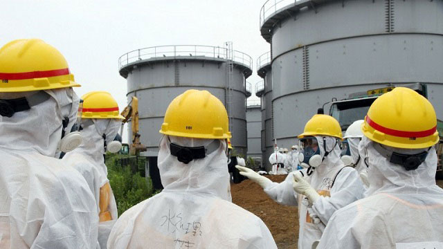 TWO MORE. Japan's nuclear watchdog members, including Nuclear Regulation Authority members, inspect contaminated water tanks at the Tokyo Electric Power Co (TEPCO) Fukushima Dai-ichi nuclear power plant on August 23, 2013. Photo by AFP/JAPAN POOL via JIJI PRESS