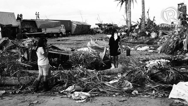 SURVIVAL. A young girl stands on debris in San Jose, Tacloban, one of the hardest-hit areas in Tacloban City. Photo by Jake Verzosa. 