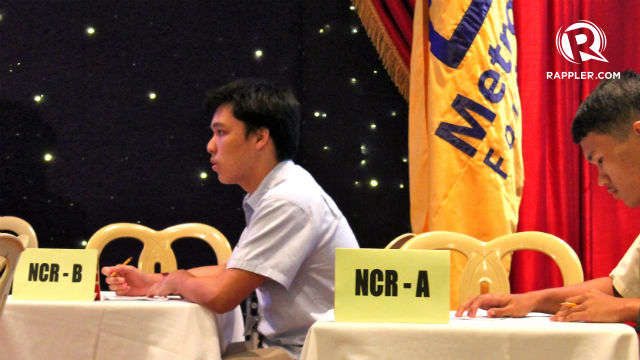THINKING ON ONE'S FEET. 1st Placer Lorenzo Quiogue of NCR-B answers a question good for 30 seconds. Photo by Kevin Julian Q. Asio