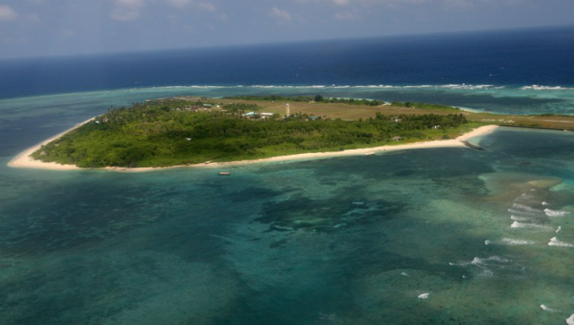 DISPUTED ISLANDS. An aerial photo shows Pag-asa (Thitu) Island, part of the disputed Spratly group of islands, in the South China Sea located off the coast of western Philippines on July 20, 2011. File photo by Rolex dela Peña/Pool/AFP