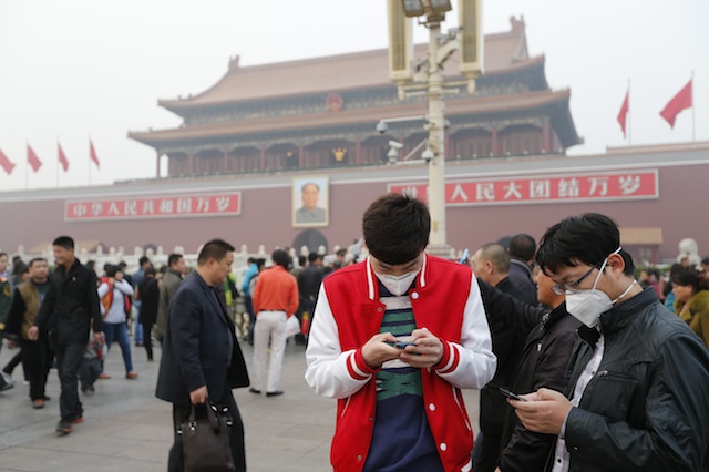 CRIME SCENE. Chinese men wearing masks are seen outside the Forbidden City at Tiananmen Square in Beijing, China, 28 October 2013. EPA/Rolex dela Pena