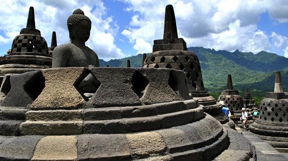 A BUDDHA ON TOP of Borobudur