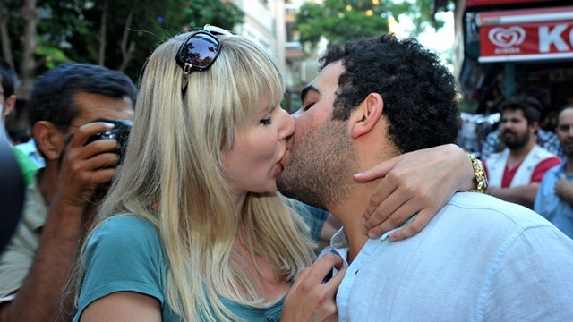 KISSING PROTEST. Turkish demonstrators kiss to protest moral warnings at subway stations in Ankara. Photo by AFP/STR