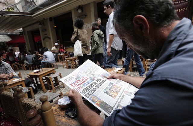 IN THE NEWS. A Turkish man reads a newspaper while sitting in a street cafe in Istanbul, Turkey, 23 September 2013. EPA/Sedat Suna