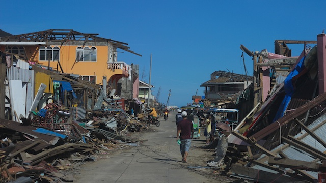 AFTER THE STORM. Wreckage from typhoon Pablo lines the streets. Photo by Karlos Manlupig