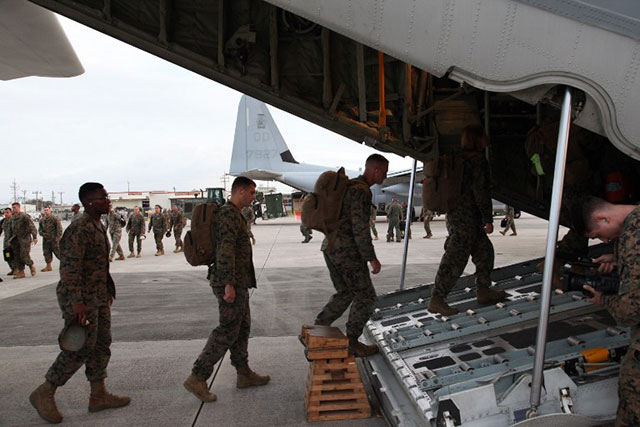 ALL SET. In this file photo, US Marines board a KC-130J Hercules aircraft on November 10, 2013 at Marine Corps Air Station Futenma, Okinawa, Japan, moments before departing for a humanitarian assistance and disaster relief mission to the Philippines. Photo by AFP/USMC/Lance Cpl. David N. Hersey