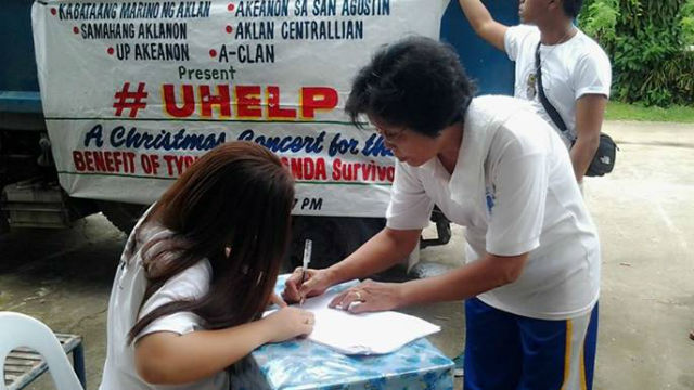 #UHELP. A typhoon-affected resident signs up to claim relief goods.