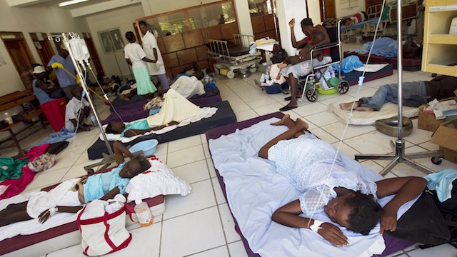CHOLERA VICTIMS. In this file photo, patients with cholera lie on mats at the crowded St. Nicholas Hospital in Saint Marc, in the Artibonite region of Haiti, 25 October 2010 in Saint Marc, Haiti. UN Photo/Sophia Paris