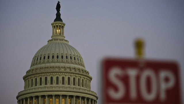 NOT OPEN FOR BUSINESS. In this photo, a stop sign is seen next to the US Congress building in Washington DC, September 30, 2013. AFP/Mladen Antonov