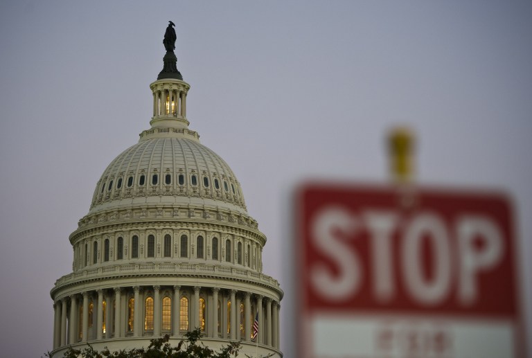 NOT OPEN FOR BUSINESS. The United States federal government went into a partial shutdown October 1, 2013, after Congress failed to pass a budget bill. In this photo, a stop sign is seen next to the US Congress building in Washington DC, September 30, 2013. AFP/Mladen Antonov