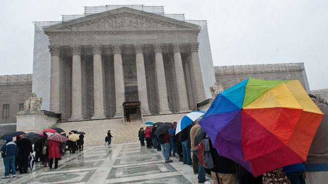 People queue to enter the Supreme Court in Washington on March 25, 2013. AFP PHOTO/Nicholas KAMM