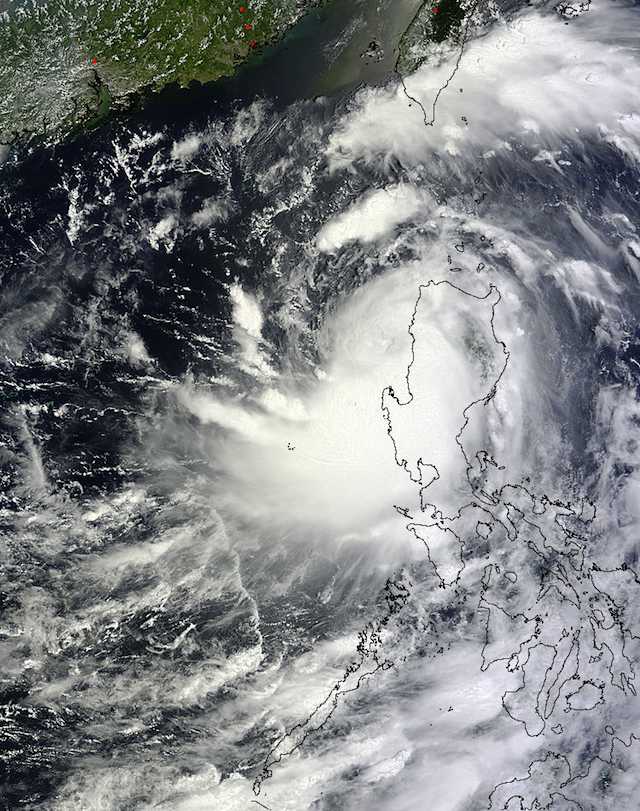 NATURE'S WRATH. The MODIS instrument on NASA's Terra satellite captured this image of Typhoon Utor (Labuyo) leaving the Philippines on Aug. 12 at 02:55 UTC (10:55 pm EDT/Aug. 11, 10:55 am Philippine time/Aug 13) when its center was near the Lingayen Gulf on the country's western side. Image courtesy NASA Goddard MODIS Rapid Response Team