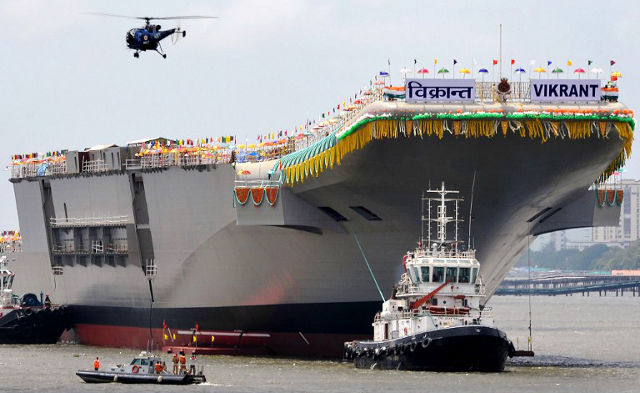 INS VIKRANT. Tugboats guide the indigenously-built aircraft carrier INS Vikrant as it leaves the Cochin Shipyard after the launch ceremony in Kochi on August 12, 2013. When the INS Vikrant comes into full service in 2018, India will become the fifth nation to have designed and built its own aircraft carrier, pushing ahead of China to join an elite club that includes Britain, France, Russia and the United States. AFP PHOTO/Manjunath KIRAN