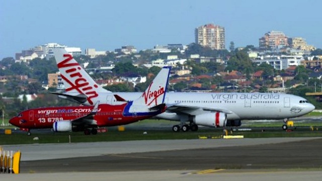 BUYING BINGE. Singapore Airlines acquires 10% of Virgin Australia, which, in turn, buys 60% of Tiger Airways Australia. Photo courtesy of AFP