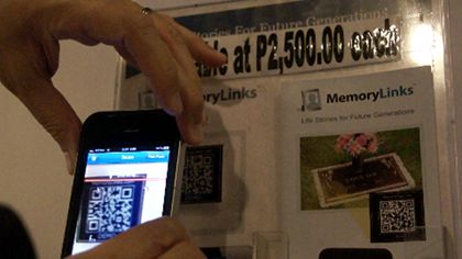 MEMORIES IN A CODE. Scanning a QR code of a deceased brings his world back to life