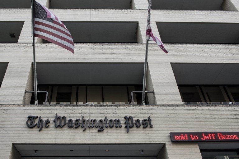 SOLD. The Washington Post is seen on August 5, 2013 in Washington, DC, after it was announced that Amazon.com founder and CEO Jeff Bezos had agreed to purchase the Post for USD 250 million. Photo by AFP/Brendan Smialowski