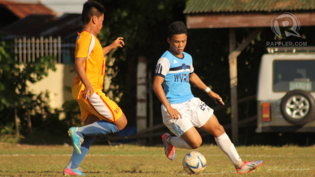 WILD WEST. A Western Visayas player moves the ball against an Ilocano opponent. Photo by Aki Yatco/Rappler
