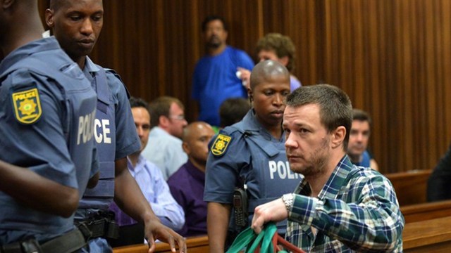 35 YEARS. Johan Pretorius (R), one of the 20 right-wing extremists convicted of high treason for a plot to kill former president Nelson Mandela and drive blacks out of the country, attends his trial at Pretoria High Court. Photo by Alexander Joe/AFP 