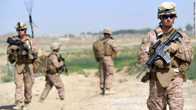 US Marines from Kilo Company of the 3rd Battalion 8th Marines Regiment head out on patrol in Garmser, Helmand Province, last June. - Adek Berry/AFP/Getty Images