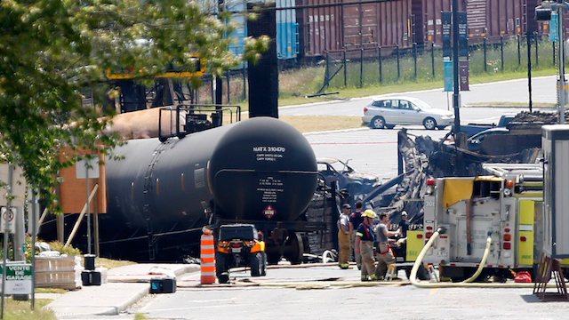 ACCIDENT ZONE. A handout photograph provided by the Surete du Quebec, or Quebec Provincial Police (SQ) on 09 July 2013 shows a view of a derailed crude oil tankers taken from outside the exclusion zone in the town of Lac Megantic, Quebec, Canada, 7 July 2013. EPA/SQ