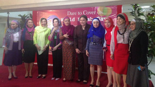 EQUALITY. Muslim and non-Muslim congresswomen don the hijab. One of them is Camarines Sur rep Leni Robredo (2nd from right).