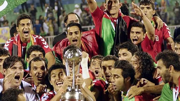 FIRST-EVER CHAMPIONSHIP. Afghanistan's players celebrate with the trophy, following their victory over India in the SAFF Championship football Cup final match in Kathmandu on September 11, 2013. Afghanistan won the match 2-0. AFP/Prakash Mathema