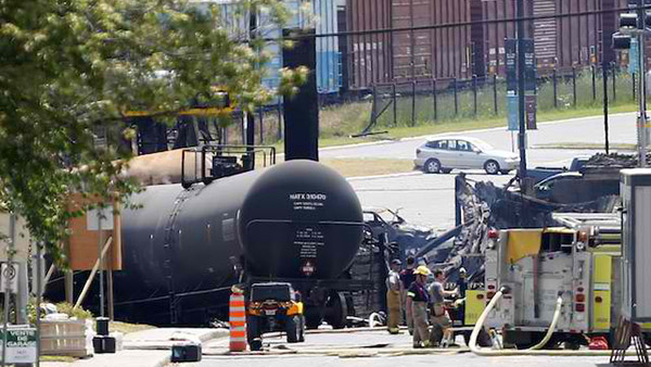 ACCIDENT ZONE. A handout photograph provided by the Surete du Quebec, or Quebec Provincial Police (SQ) on 09 July 2013 shows a view of a derailed crude oil tankers taken from outside the exclusion zone in the town of Lac Megantic, Quebec, Canada, 7 July 2013. EPA/SQ