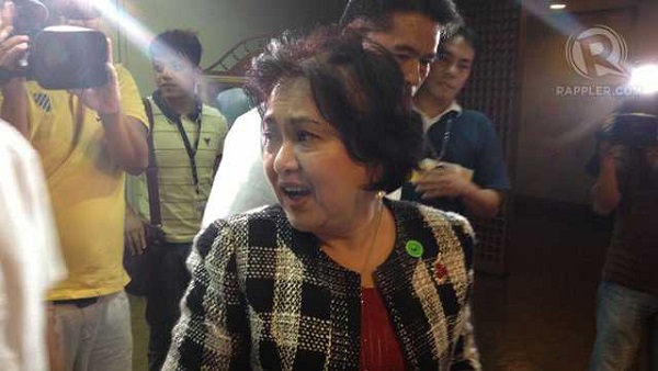 GRACEFUL EXIT. COA Chairperson Grace Pulido-Tan leaves the Senate after enduring a one-hour grilling from Sen Jinggoy Estrada. The feisty Tan holds her ground and at times answers back. Photo by Ayee Macaraig/Rappler 