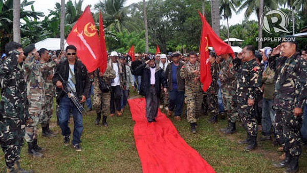 MISUARI. Moro National Liberation Front leader Nur Misuari inspects his armed followers in one of the group's camps in Indanan, Sulu. He declares he is breaking away from the government because they have been sidelining his group. AFP file photo