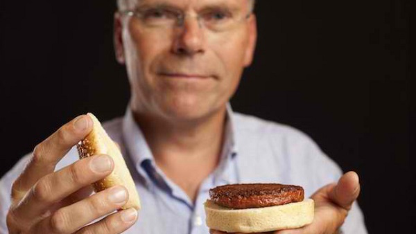 100% LAB GROWN. Maastricht University's Professor Mark Post with a burger made from Cultured Beef. Photo by PA Wire/David Parry