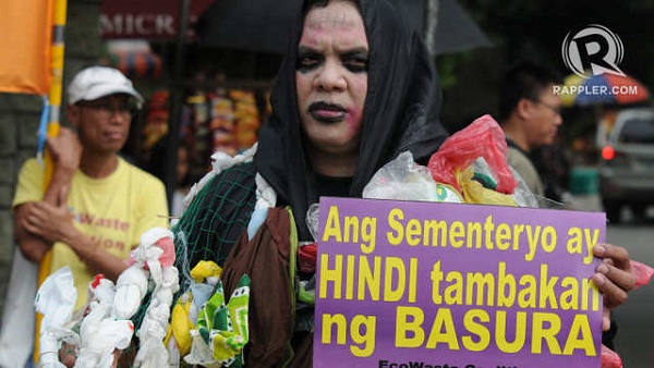 KEEP THE 'BASURA MONSTER' AWAY. The EcoWaste Coalition stages a tableau on October 30 to show citizens the ghastly effects of a garbage-ridden 'Undas.' Photos by Jose Del
