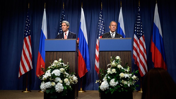 epa03867021 US Secretary of State John Kerry, (L), and Russian Foreign Minister Sergei Lavrov, (R), speak after making statements following meetings regarding Syria, at a news conference at the Geneva, Switzerland, 14 September 2013. The United States and Russia have agreed on a proposal to eliminate Syria's chemical weapons arsenal. EPA/MARTIAL TREZZINI