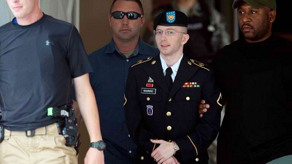 GUILTY, AND NOT GUILTY. US Army Private First Class Bradley Manning leaves a military court facility after hearing his verdict in the trial at Fort Meade, Maryland on July 30, 2013. Photo by AFP/Saul Loeb