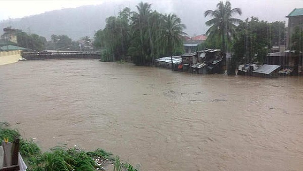 SWOLLEN RIVER. A swollen river, caused by continuous monsoon rains, flows through Olongapo City, September 23, 2013. Photo courtesy KC Sarmiento