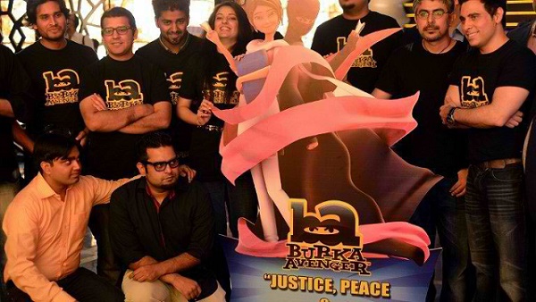 JUSTICE, PEACE, EDUCATION' Aaron Haroon Rashid, one of Pakistan's biggest pop star (R) poses with his team at the press presentation of cartoon show Burka Avenger in Rawalpindi on August 4, 2013. Photo by AFP/Farooq Naeem
