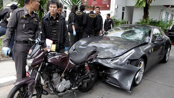 epa03381733 Thai police officers inspect a Ferrari car owned by alleged hit-and-run Vorayuth Yoovidhya (not in picture) grandson of the creator of Red Bull energy drink in Bangkok, Thailand, 03 September 2012. Vorayuth was arrested on charges of killing a Thai policeman with his Ferrari. He's alleged to have rear-ended the motorcycle of police sergeant major and dragged his body under the car for more than 200 metres then he fleeing the scene of the accident while the victim was left dead on the road, police said. EPA/STR THAILAND OUT