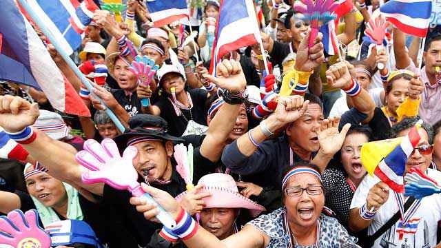 'NO OTHER DAY'. Thai anti-government protesters shout slogans during a rally occupying the Finance Ministry in Bangkok, Thailand, 26 November 2013. Photo by EPA/RUNGROJ YONGRIT