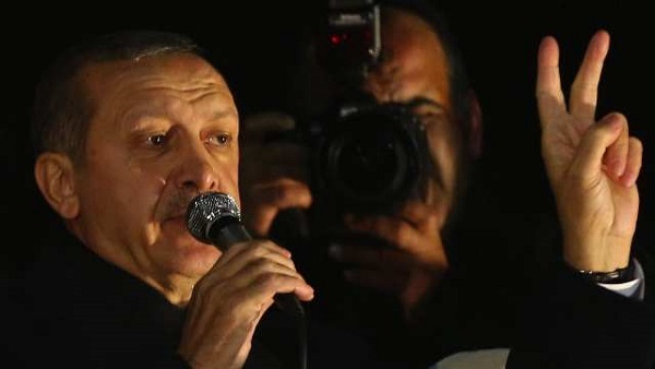 TWO OUT. Turkey's Economy and Interior ministers step down in the midst of a graft scandal, just hourse after Prime Minister Tayyip Erdogan arrives from a foreign trip. Here, Erdogan addresses supporters upon his arrival to Esenboga Airport in Ankara December 24, 2013 AFP/Adem Altan