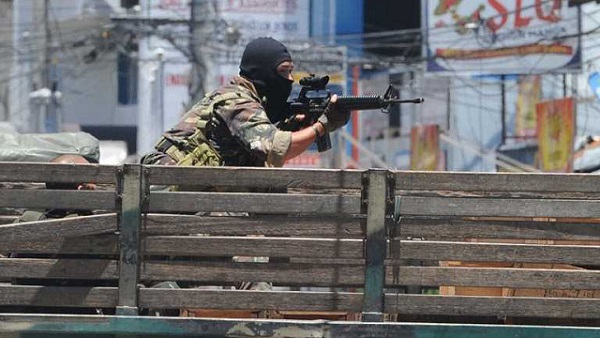TAKING AIM. A soldier on board a truck aims his weapon towards rebel positions in Zamboanga City. Photo by AFP