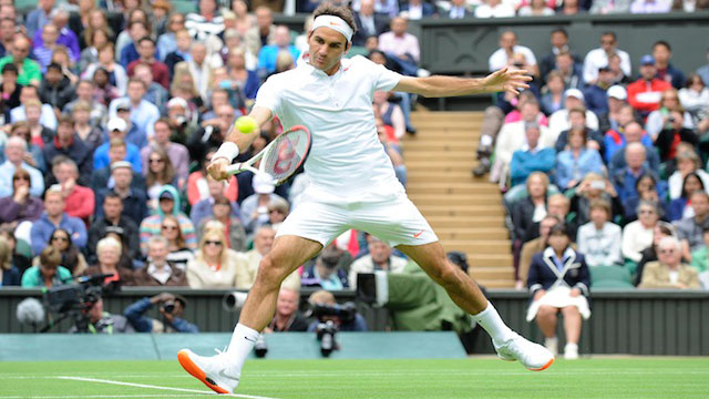 OUT. In this file photo, Roger Federer of Switzerland returns to Victor Hanescu of Romania during their first round match for the Wimbledon Championships at the All England Lawn Tennis Club, in London, Britain, 24 June 2013. Photo by EPA/Gerry Penny