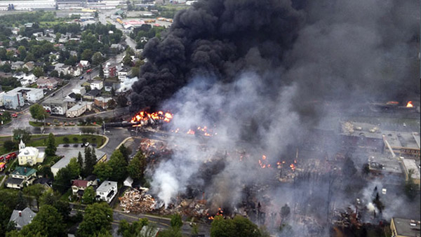 INFERNO. An aerial photograph shows a fire caused by the derailment of a 73 car freight train hauling crude oil as it consumes a large part of Lac Megantic, Quebec, Canada. Photo by EPA/Royal Canadian Mounted Police