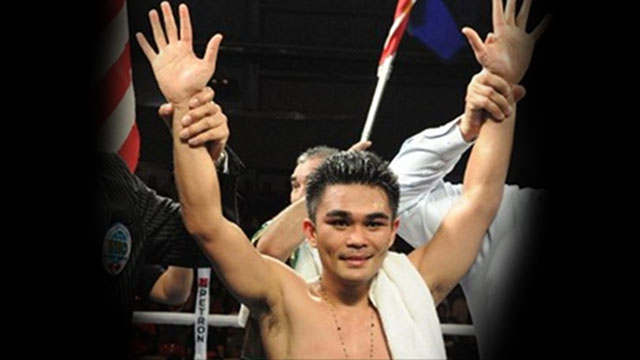 VICTORIOUS. Philippine boxer Brian "Hawaiian Punch" Viloria beat Mexican Hernan "Tyson" Marquez on Sunday, November 17. Photo by AFP