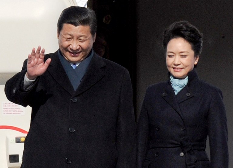 MORE FOREIGN TRIPS. Chinese President Xi Jinping will embark on a trip to Latin America on Friday, May 31. In this file photo, Xi and his wife Peng Liyuan get off the plane at Vnukovo airport outside Moscow on March 22, 2013. File photo by Alexander Nemenov/AFP
