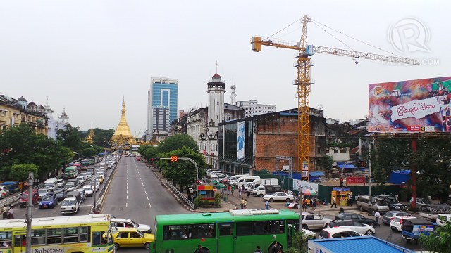 OLD, NEW. Yangon's classic pagodas and old colonial buildings now share the view with buildings under construction as the country's real estate market booms to meet investor demand. Photo by Rappler/Ayee Macaraig, 2013 SEAPA Fellow 