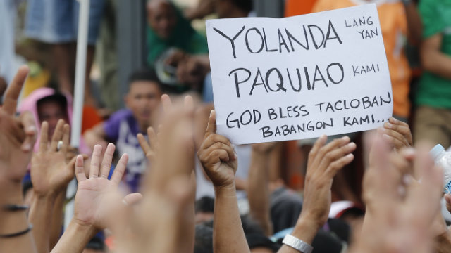 HIGH SPIRITS. Pacquiao's win vs Rios lifts the spirits of typhoon Yolanda survivors. Photo by Rolex Dela Peña
