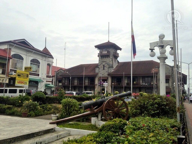 BACK IN BUSINESS. The Zamboanga City Hall reopens September 30, 2013 after fighting in the city forced it to suspend operations for 3 weeks. In this photo, the Philippine flag flies half-mast on the first day of the resumption of the city hall's operations. Photo by Karlos Manlupig/Rappler.com