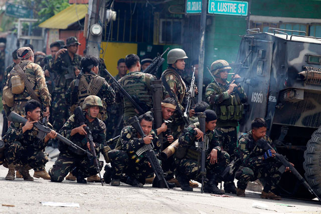 'TIME TO COOPERATE.' Malacañang says the state will not hesitate to use its forces. Photo by EPA