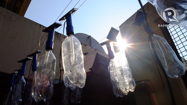 LITERS OF LIGHT. The solar panels power lamps fashioned from soda bottles